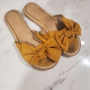 Torrid mustard colored bow flops size 13w
